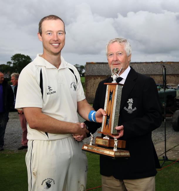 Paul Miller is awarded the Man of  the Match Trophy